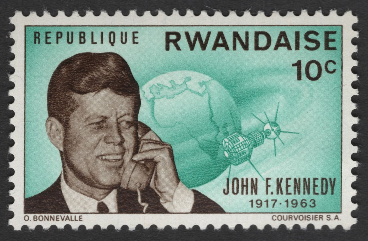 SCG11346 - John F. Kennedy Memorial & Space Progress – 10G Commemorative (Rwanda)